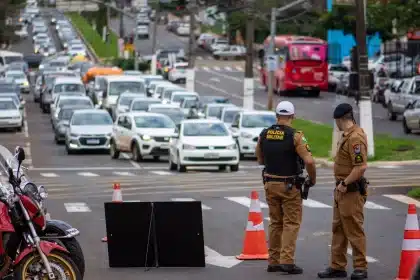 Police barriers and traffic control at a busy urban intersection during a public gathering