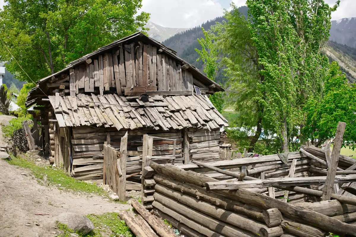 Historic marketplace in a mountainous valley with traditional architecture and diverse buildings reflecting centuries of