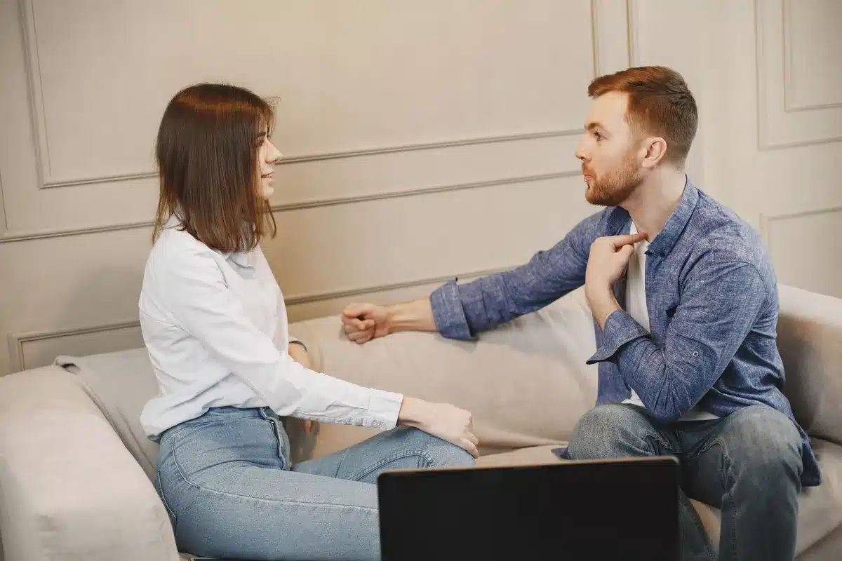 A couple engaged in thoughtful conversation, demonstrating active listening and open communication