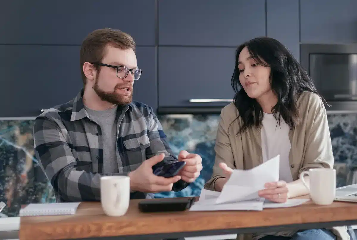 Partners reviewing finances or household planning together, showing shared stewardship