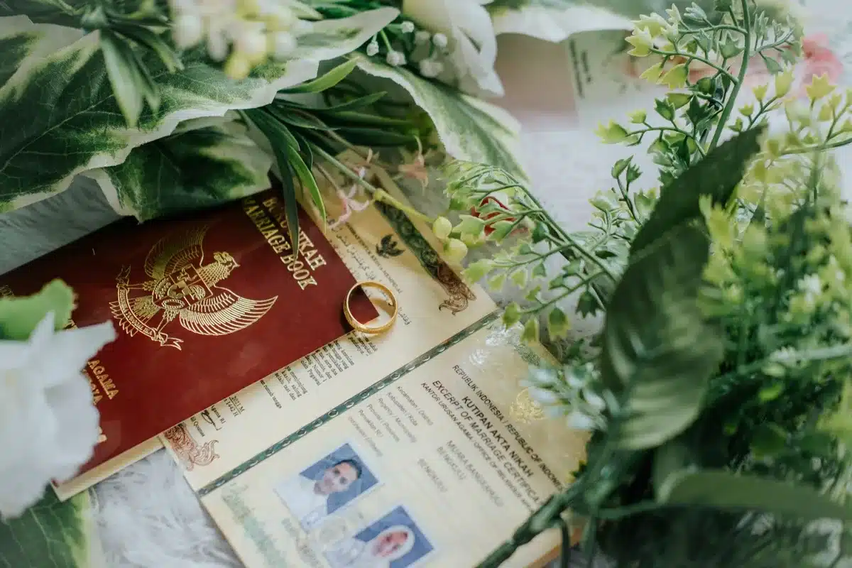 Couple reviewing official documents and paperwork related to family identity and religious registration