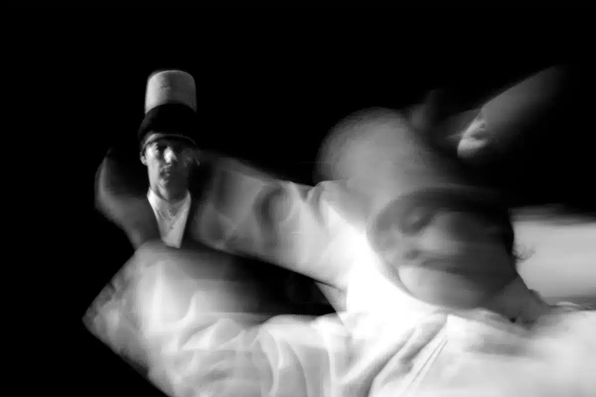 Silhouette of a dancer in dynamic pose with raised leg and extended arms, symbolizing cosmic movement and spiritual tran