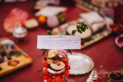 Ritual offerings and candles placed before a snake shrine during Nag Panchami celebration