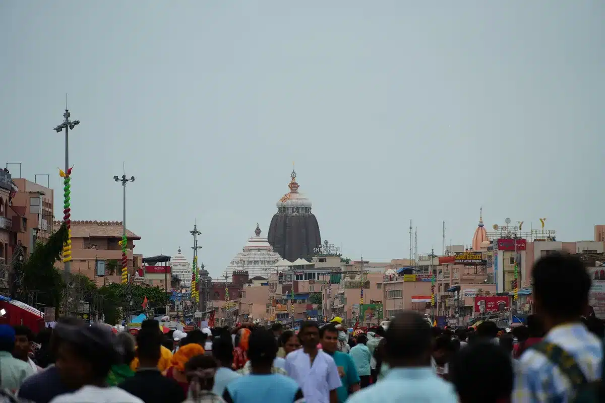 Thousands of pilgrims gathered at a religious site during festival season, filling streets and courtyards