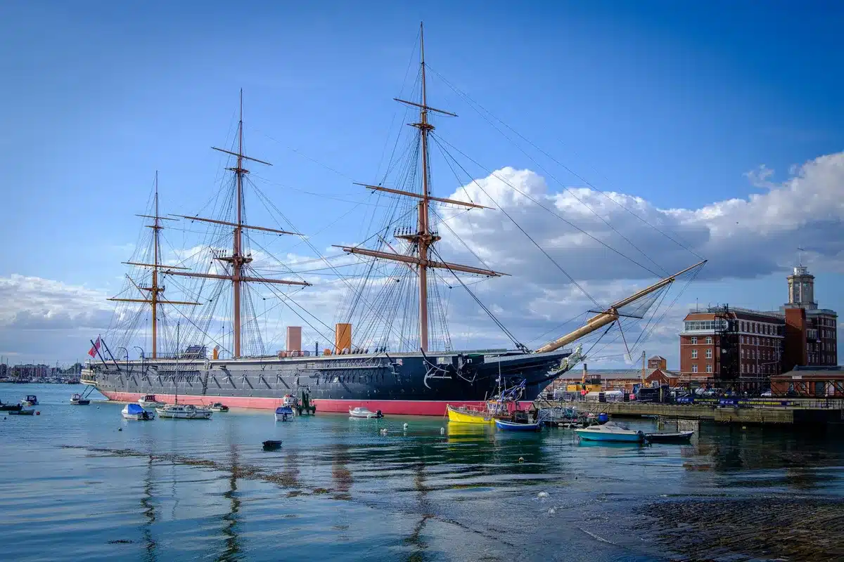 Historical sailing ship crossing the ocean during the era of indentured labor migration