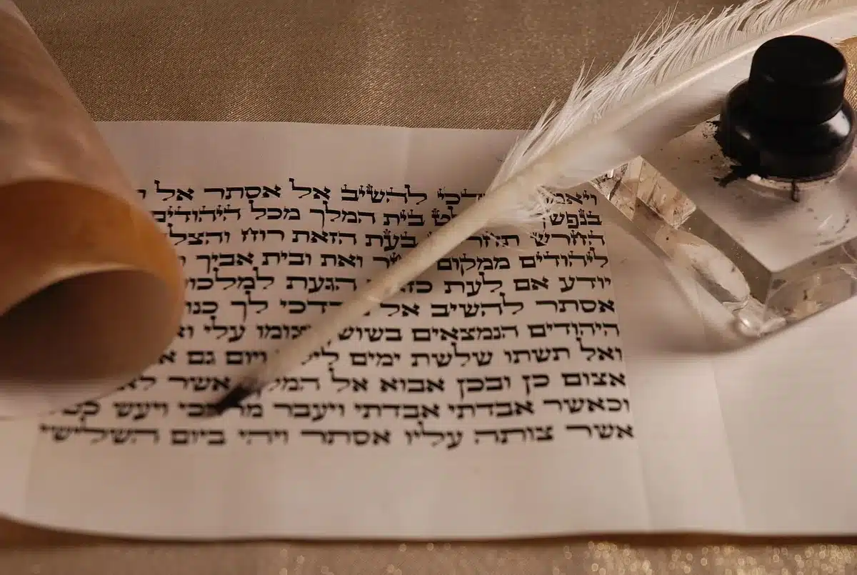 Ancient Hindu religious texts and manuscripts arranged on a table