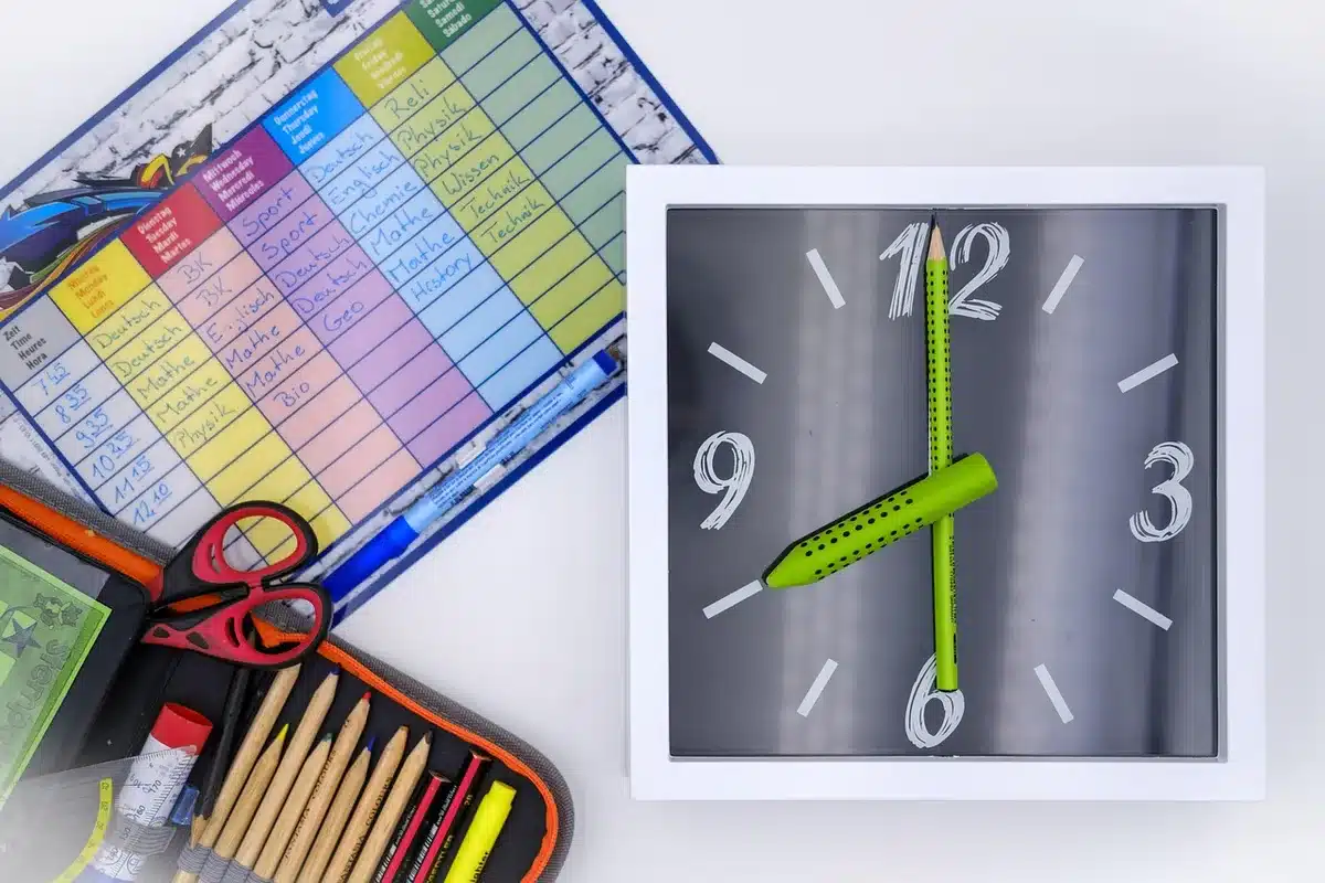 Printed event timetable and clock showing festival timings