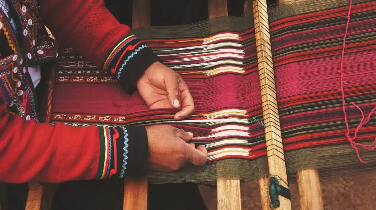 Local artisans selling traditional textiles near a heritage site