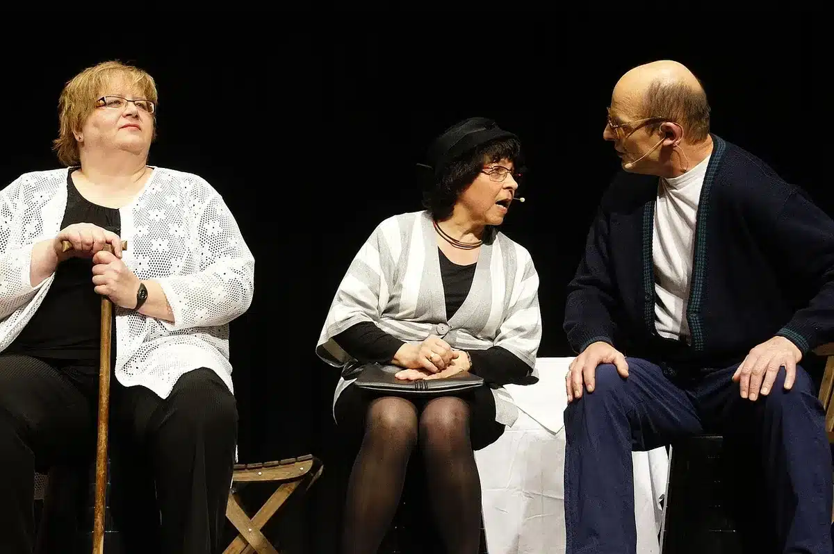 Two actors in a tense domestic scene illustrating family pressure